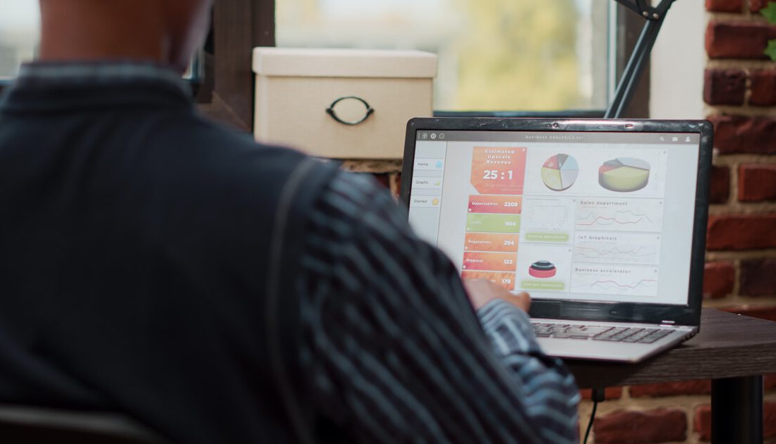 Analytics dashboard on a laptop showing sales channels, revenue and conversion metrics