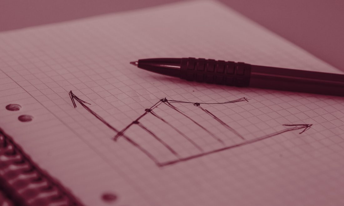 Hand-drawn line graph with a sharp step, sketched in pen on squared notebook paper
