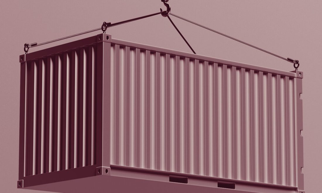 A single shipping container suspended from a crane hook, rendered in wine-toned monochrome