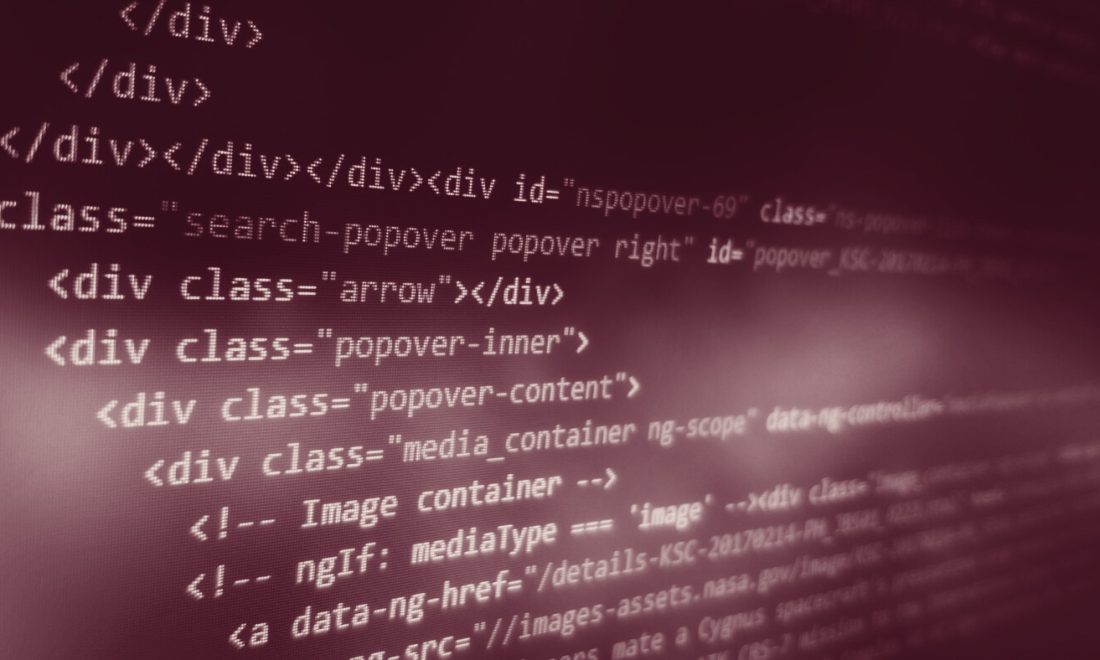 HTML page source on a screen, shown in close-up