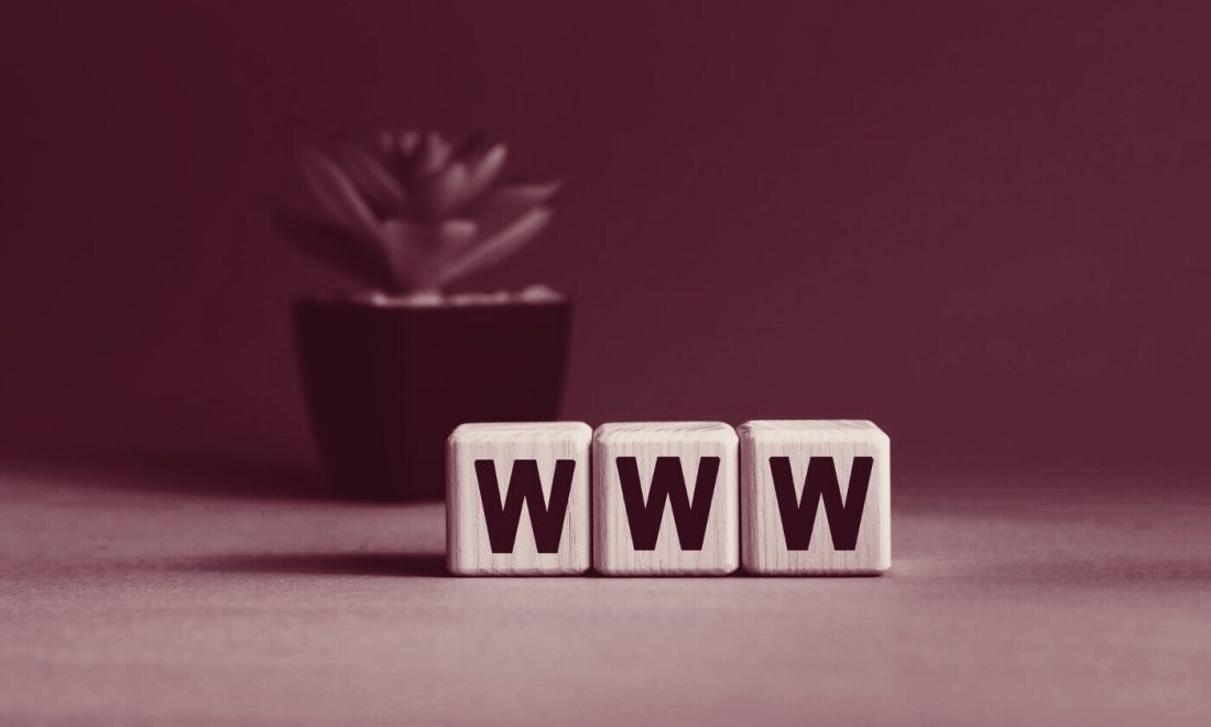 Wooden blocks spelling WWW, illustrating a CNAMEd hostname and the Safari 27.2 CNAME cookie fix